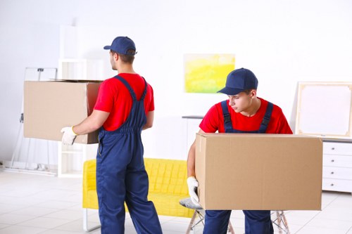 Student removals team loading boxes for a move in Watford