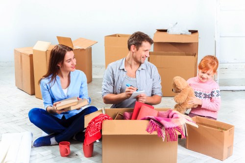 Removal team handling moving equipment safely during a property relocation