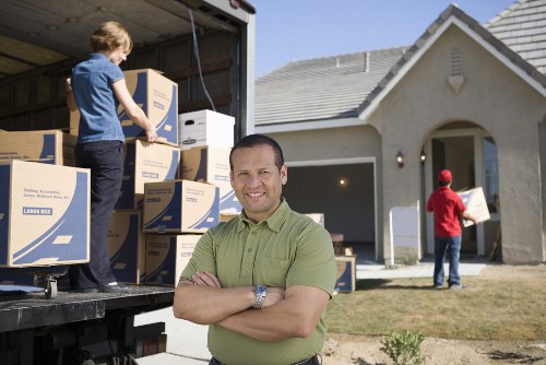 Professional man with van assisting with furniture transport