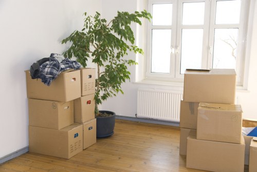 Prepared boxes and furniture loaded into a moving truck in Watford