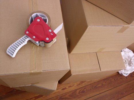 Trained movers lifting furniture carefully during a Watford removals job