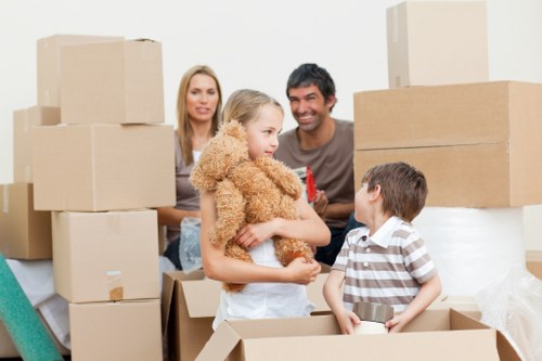 Professional moving team loading furniture into a removal van